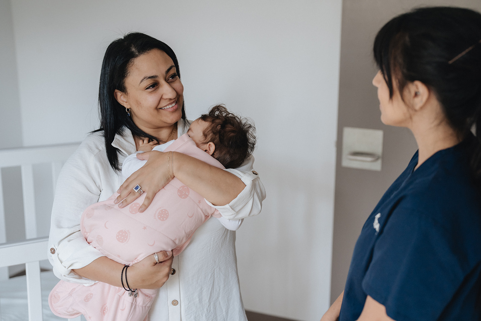 A Karitane Nurse with a mother and baby