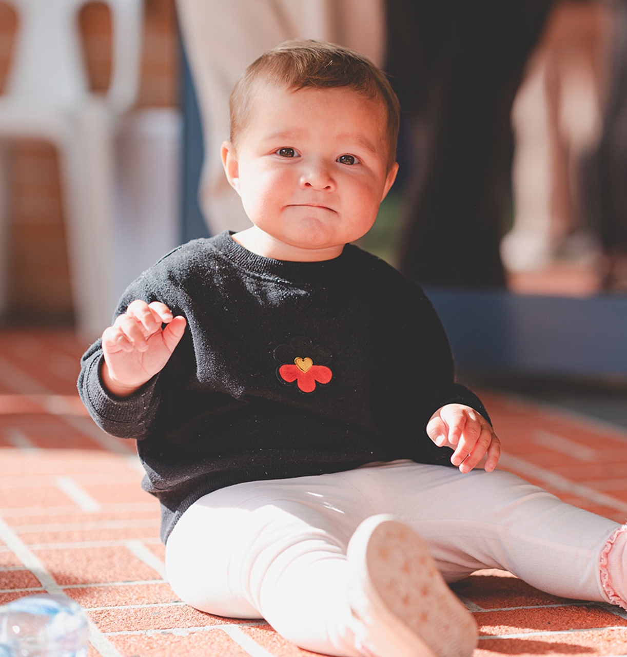 A baby looking at the camera